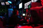 Operations Specialist 2nd Class Jessica Patterson monitors a radar screen on the Strike Control System in the Combat Direction Center (CDC) aboard USS John C. Stennis (CVN 74).