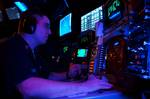 Combat Direction Center (CDC) Operations Specialist 1st Class Greg Glaeser of Chicago, Ill., monitors the surrounding area with the Identification Friend or Foe (IFF) system while aboard the aircraft carrier USS John C. Stennis (CVN 74).