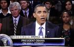 In a photo taken from a video screen, President Barack Obama answers questions on jobs and the economy during a town hall-style gathering hosted by CNBC, Monday, Sept. 20, 2010, at the Newseum in Washington.