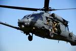 A Pararescueman from the 31st Rescue Squadron leans out of the door of a 33rd Rescue Squadron HH-60 Pave Hawk during a Combat Search and Rescue training scenario for PACIFIC THUNDER at Osan Air Base, Republic of Korea Oct. 12, 2012. PACIFIC THUNDER 2012 is an annual two-week exercise where members of the 33rd and 31st Rescue Squadrons met up with the 25th Fighter Squadron and multiple other units at Osan AB, to test CSAR tactics to prepare for real-world emergency situations. (U.S. Air Force pho