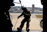 A pararescueman from the 31st Rescue Squadron perform alternate insertion and extractions from a 33rd Rescue Squadron HH-60 Pave Hawk during a Combat Search and Rescue training scenario for PACIFIC THUNDER at Osan Air Base, Republic of Korea Oct. 12, 2012. PACIFIC THUNDER 2012 is an annual two-week exercise where members of the 33rd and 31st Rescue Squadrons met up with the 25th Fighter Squadron and multiple other units at Osan AB, to test CSAR tactics to prepare for real-world emergency situati