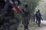 Bosnian special police units get ready to check the personal ID of the residents on the road towards Bosnian village of Gornja Maoca, 200 kms north from Sarajevo, on Saturday,Oct. 29, 2011. Special police units raided homes Saturday in a Bosnian village linked to the gunman who fired an automatic weapon at the U.S. Embassy in Sarajevo in what authorities called a terrorist attack. The raids came as 17 suspected associates of the shooter, all said to be members of the ultraconservative Wahhabi Mu