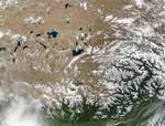 NASA satellite image of the southern area of Tibetan Plateau The plateau is a high-altitude arid steppe interspersed with mountain ranges and large brackish lakes. Annual precipitation ranges from 100 mm to 300 mm and falls mainly as hailstorms.