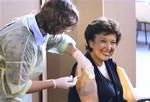 France's Health Minister Roselyne Bachelot receives the vaccine against Influenza A (H1N1) virus, in a vaccination center in Paris, Thursday Nov. 12, 2009, on the first day of the vaccination campaign in France