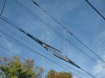 A section insulator installed at a section break in Amtrak's 12 kV catenary. To allow maintenance to sections of the overhead line without having to turn off the entire system, the overhead line system is broken into electrically separated portions known as sections.