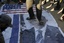 Palestinian Salafis "al-Qaeda" burning U.S. and Israeli flags as they burn image of U.S. President Barack Obama during a protest against what they said was a film being produced in the U.S. that was insulting to the Prophet Mohammad in Rafah in southern Gaza Strip on September 14, 2012. Palestinians Salafis "al-Qaeda" supporters staged demonstration in both the occupied West Bank and Gaza Strip on Friday to denounce the film, burning U.S. and Israeli flags and clashing with police in Jerusalem.Photo by Ahmed Deeb / WN