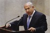 Israel's Prime Minister designate Benjamin Netanyahu, addresses the Knesset, Israel's Parliament, ahead of the swearing-in ceremony of his new government in Jerusalem, Tuesday, March 31, 2009. Netanyahu struck a conciliatory tone as he took office Tuesday, promising to seek a "permanent arrangement" with the Palestinians and "full peace" with the entire Arab and Muslim world