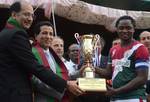 Mos Home Nasir Aslam wani along with Jammu and kashmir sports Minister R.S Chib and General Post Master Jammu kashmir circle John Samuel give away the winning trophy to Mohun Bagun captain After the beat Jammu kashmir elven in Good will Friendly Football match played at Bakshi stadium in Srinagar on Saturday on 08, September 2012.