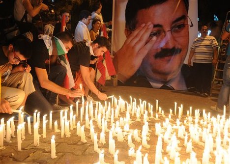 Lebanese mourners light candles during a vigil for Brig. Gen. Wissam al-Hassan and at least seven others who were killed in a Friday bomb attack in Beirut, Saturday, Oct. 20, 2012.