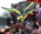 One of the Royal Family Member of Kolkata perform the ritualistic 'Nabapatrika Snan' - bathing a banana tree - in the Ganges river, in Kolkata, 21 October 2012. The four day long festival of Durga Puja, which began on 19 October this year, will culminate with the immersion of the clay idol of the Hindu Goddess Durga, which symbolises the power and the triumph of good over evil in Hindu mythology