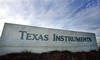 The entrance sign to the Texas Instruments corporate campus is shown in a Dallas file photo from Jan. 21, 2006 in Texas.