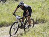 Lance Armstrong negotiates the route on his way to a second-place finish in the Power of Four mountain bicycle race at the base of Aspen Mountain in Aspen, Colo.