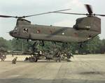 Field artillery section sling loading an M198 howitzer for airlift by a CH-47 Chinook. The Boeing CH-47 Chinook is a twin-engine, tandem rotor heavy-lift helicopter.