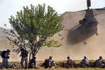 File - Soldiers prepare to load into a CH-47 Chinook helicopter during an air assault mission in the Bermel district of Paktika province, Afghanistan. The results of a recently-released mental health study found Soldier stress on the rise in Afghanistan.