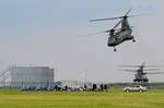 GRAND ISLE, La. - A pair of Chinook helicopters depart Coast Guard Station Grand Isle, La., after President Barack Obama addressed the media concerning the ongoing, multi-agency response to the Deepwater Horizon incident, May 28, 2010. Obama stressed that Adm. Thad Allen, national incident commander of the response, has all resources to manage the response at his disposal. U.S. Coast Guard photo by Petty Officer 3rd Patrick Kelley. (891117) ( )