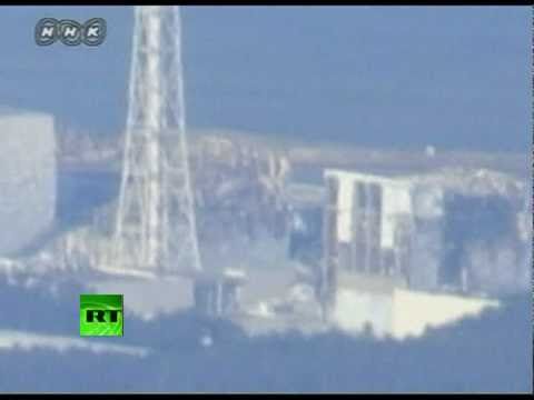 Video of helicopters water-bombing nuclear reactor, close-up shots of Fukushima