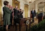 President Barack Obama walks to a desk in the East Room of the White House in Washington, Thursday, July 1, 2010, to sign the Iran Sanctions Bill imposing tough new sanctions against Iran as further punishment for the country's continuing ambitions to become a nuclear power, Applauding, from left are: House Speaker Nancy Pelosi of Calif., Senate Banking Committee Chairman Sen. Christopher Dodd, D-Conn., House Foreign Affairs Committee Chairman Rep. Howard Berman, D-Calif., House Majority Leader