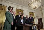 President Barack Obama signs the Iran Sanctions Bill imposing tough new sanctions against Iran as further punishment for the country's continuing ambitions to become a nuclear power, Thursday, July 1, 2010, in the East Room of the White House in Washington. Looking on, from left are: House Speaker Nancy Pelosi of Calif., Senate Banking Committee Chairman Sen. Christopher Dodd, D-Conn., House Foreign Affairs Committee Chairman Rep. Howard Berman, D-Calif., House Majority Leader Steny Hoyer of Md.