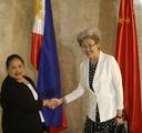 Chinese Vice Foreign Minister and special envoy Fu Ying, right, and Philippine Undersecretary for Foreign Affairs Erlinda Basilio shake hands prior to their meeting in the annual 18th Foreign Ministry Consultations (FMC) in Manila, Philippines Friday, Oct. 19, 2012.