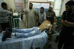 A Palestinians wounded in the al-Najar hospital in Rafah following an Israeli air strike in Rafah in the southern Gaza Strip on October 07, 2012. Spokesman and the Ministry of Health in Gaza ten Palestinians were injured and two of them in very critical condition due to the raid carried out by an Israeli reconnaissance aircraft.Photo by Ahmed Deeb / WN