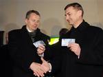 Estonia's Prime Minister Andrus Ansip, right, and Minister of Finance Jurgen Ligi pose with 20 Euro banknotes which they withdrew from an ATM cash machine in Tallinn, early Saturday, Jan. 1, 2011. The Baltic state of Estonia early Saturday became the 17th European Union member to adopt the joint European currency, the euro. The small nation's decision to change from the Estonian kroon to the euro currency was the final step in a two decade-long effort to integrate its economy with Europe after i