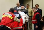 Presumed former concentration camp guard John Demjanjuk arrives at the court room for his trial in Munich, southern Germany, on Tuesday, Dec. 1, 2009.