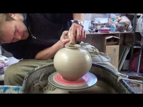 Throwing a spherical round Korean type pottery Vase on the wheel