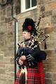 A bagpiper busking in central Edinburgh.