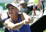 Caroline Wozniacki of Denmark returns a shot against Kaia Kanepi of Estonia during the final match of the Korea Open tennis championships in Seoul, South Korea