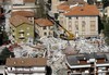 An aerial view of rescue operations in L'Aquila, a day after a powerful earthquake struck the Abruzzo region in central Italy, on Tuesday, April 7, 2009. The death toll from Italy's worst earthquake in three decades jumped to 207 as bodies were recovered and identified. Fifteen people remained unaccounted fo