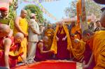 Tibetan Buddhism in India: His Holiness the fourteenth Dalai Lama of Tibet prostrating on his arrival at the Mahabodhi temple in Bodhgaya, Bihar State of India on December 31, 2011.