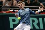 Paul Henri Mathieu of France plays a return to Andreas Seppi of Italy during their first round match of the Paris Tennis Masters tournament, Monday, Oct. 30, 2006.