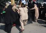 Indian Female police detain Member of a women separatist group Dukhtar-e-Millat (Daughter of Nations) during a protest in Srinagar, the summer capital of Indian Kashmir, 21 September 2012. Scores of women separatist activists of Dukhtar-e-Millat stages a protest on 21 september against an anti-Islam video. Police fired tear gas to break up the march and detained at least four women. Authorities clamped curfew in old parts of Srinagar while shops and business shut in rest of the city against the