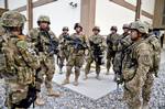 U.S. Forces Afghanistan HHC Commander, Capt. Jerry Mitchell from the Florida National Guard briefs Force Protection Team Bravo as they prepare to relieve the first rotation of guards maintaining security and returning fire during an attack, Sept 13. Insurgents attacked the International Security Assistance Force Afghanistan headquarters and the U.S. Embassy in Kabul on Tuesday with small-arms fire from outside the secure zone surrounding these compounds. Afghan and coalition forces trapped the i