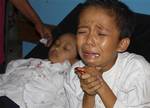 A boy who was injured in the earthquake reacts at a hospital in Tasikmalaya, West Java, Indonesia, Wednesday, Sept. 2, 2009. A powerful earthquake rattled southern Indonesia on Wednesday, killing at least dozens of people crushed by falling rock or collapsed buildings and sending thousands fleeing outdoors for safety in the middle of the work day.