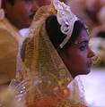 Brides and grooms sit during a mass marriage ceremony on 123 Couples who will be tying the knot out on 1st July 2012 at Haldiram Banquets organisational by Vishwa Jagriti Mission Trust in Kolkata on Sunday 1st July 2012