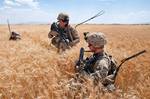 U.S. Army 2nd Lt. Nicholas Prieto, a platoon leader with the 82nd Airborne Division's 1st Brigade Combat Team, talks to his platoon sergeant, Sgt. 1st Class Frank Downing, as the platoon manuevers on a position previously held by insurgents June 30, 2012, Ghazni Province, Afghanistan. Prieto is from Rockingham, N.C., and Downing is from Mexico, N.Y. (U.S. Army photo by Sgt. Michael J. MacLeod, Task Force 1-82 PAO)