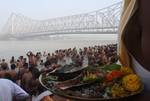 Devotee performs traditional ritual 'Tarpan' at the river of Ganga on the occasion of Sarva Pitri Amavasya to mark the end of Pitrupaksha in Kolkata on 15 October 2012. Pitru Paksha Shradh, or Pitr Paksh Shraddh, is the annual rites and rituals offered to ancestors, relatives and dead parents in the month of Ashwin in North India