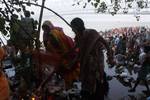 Devotee performs traditional ritual 'Tarpan' at the river of Ganga on the occasion of Sarva Pitri Amavasya to mark the end of Pitrupaksha in Kolkata on 15 October 2012. Pitru Paksha Shradh, or Pitr Paksh Shraddh, is the annual rites and rituals offered to ancestors, relatives and dead parents in the month of Ashwin in North India