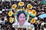 Trinamool Congress Supporters holding a poster of West Bengal Chief Minister Mamata Banerjee during the Shaheed Diwas rally in Kolkata on Saturday to commemorate killing of 13 Youth congress activities in a police fireing in 1993 21 July 2012