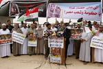 Palestinians hold slogans which read in Arabic 