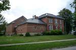 The Cheboygan County Historical Museum Complex, originally built as the Cheboygan County Sheriff Residence with attached jail cells (1882) and the New Jail addition (1912-14).