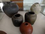 Various pottery in earth colors on display at the Palawan Museum in Puerto Princesa