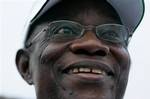 Opposition presidential candidate John Atta Mills speaks to supporters at his final campaign rally in Tema, Ghana Friday, Dec. 5, 2008. Mills will face ruling party candidate Nana Akufo-Addo and six other candidates in presidential elections on Sunday, Dec. 7, as two-term leader John Kufuor prepares to hand off power in the West African nation.