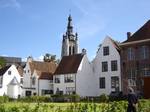 The Beguinage of Courtray. Kortrijk originated from a Gallo-Roman town, called Cortoriacum at a crossroads near the Leie river and two Roman roads.