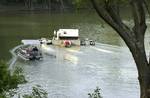 Kentucky River, Kentucky (May 26)--A smaller float-barge with additional aerators was added to the operation to help increase the oxygen levels in the Kentucky River. The Environmental Protection Agency requested assistance from the Gulf Strike Team when a distillery spills hundreds of thousands of gallons of bourbon into the river. USCG photo by PA2 Angel Deimler (80564) ( BOURBON SPILL (FOR RELEASE) )