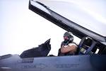 U.S. Air Force Brig. Gen. Scott Dennis, an F-16C pilot and commander of the 451st Air Expeditionary Wing, puts on his oxygen mask before engine start-up, Kandahar Airfield, Afghanistan, April 5, 2012. The mission of the 451st Expeditionary Fighter Squadron is to deliver decisive airpower on target, on time.