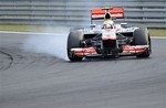 Britain's McLaren driver Lewis Hamilton brakes his race car during the Hungarian Formula One Grand Prix at the Hungaroring circuit outside Budapest, Hungary