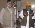 Maulana Fazlur Rehman, right, a leader of Pakistan´s six-party religious alliance of Muttahida Majlis-e-Amal (MMA), escorts Pakistani Prime Minister Zafarullah Khan Jamali, left, to their talks at Rehman´s residence in Islamabad, Pakistan, Sunday, July 13, 2003. They discussed several issues including the crucial issue of Legal Framework Order (LFO), a constitutional amendments introduced by President Pervez Musharraf in August last year, giving him powers to sack the elected assembly and ensure