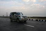 Participants drive past Dal Lake during the 13th Raid De Himalaya Rally car race organised by the Tourism department and Himalayan Motor Sport Association in Srinagar on October 14, 2011. Some 72 vehicles participated in the rally.